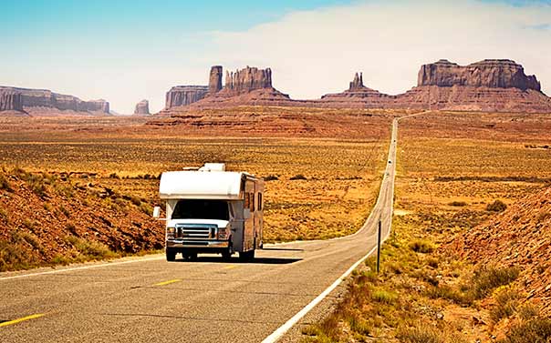 RV driving down a desert road